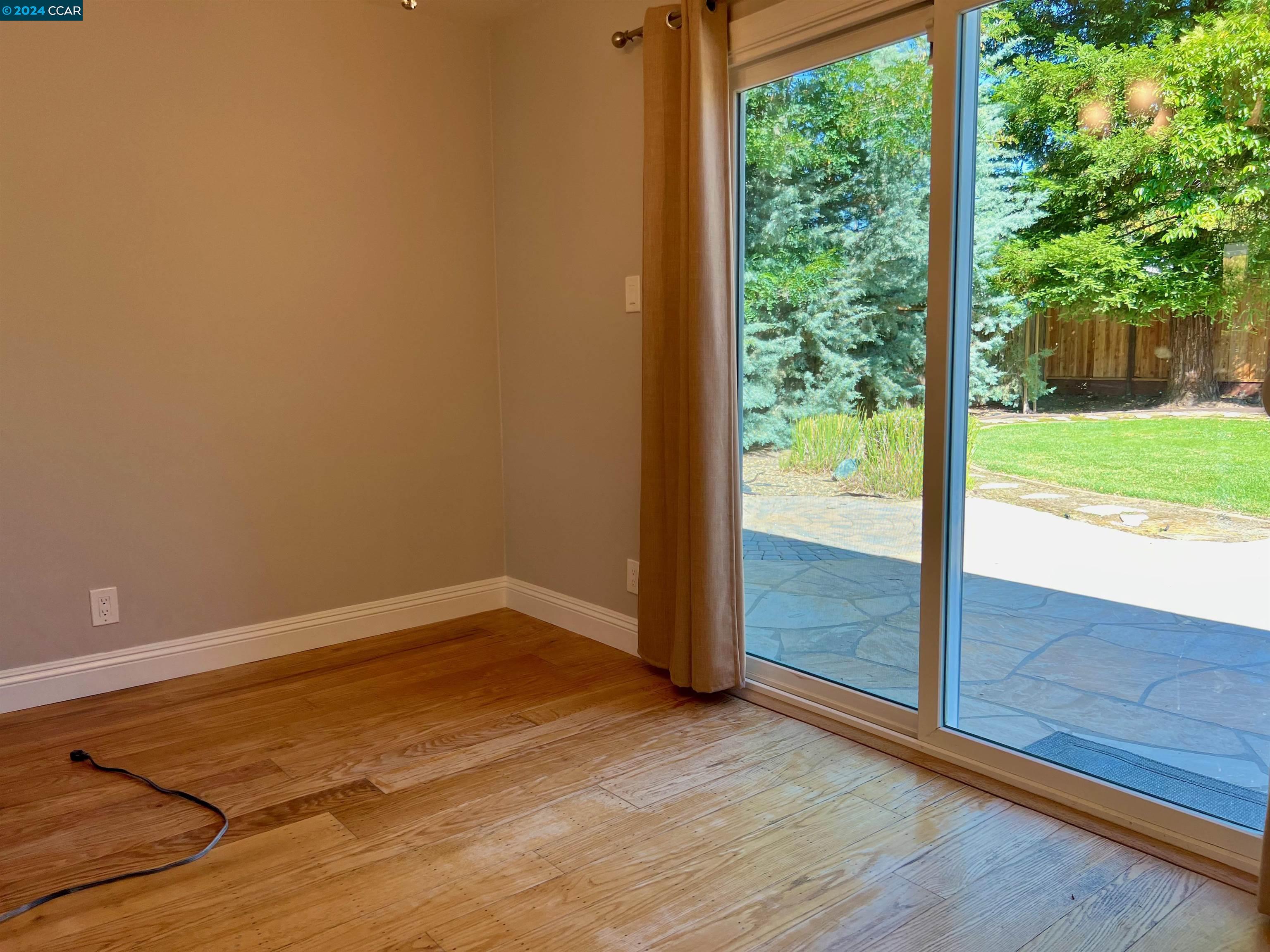 1282 Windermere Way Concord, CA 94521 - Photo 5 of 21 a view of a room with wooden floor and windows