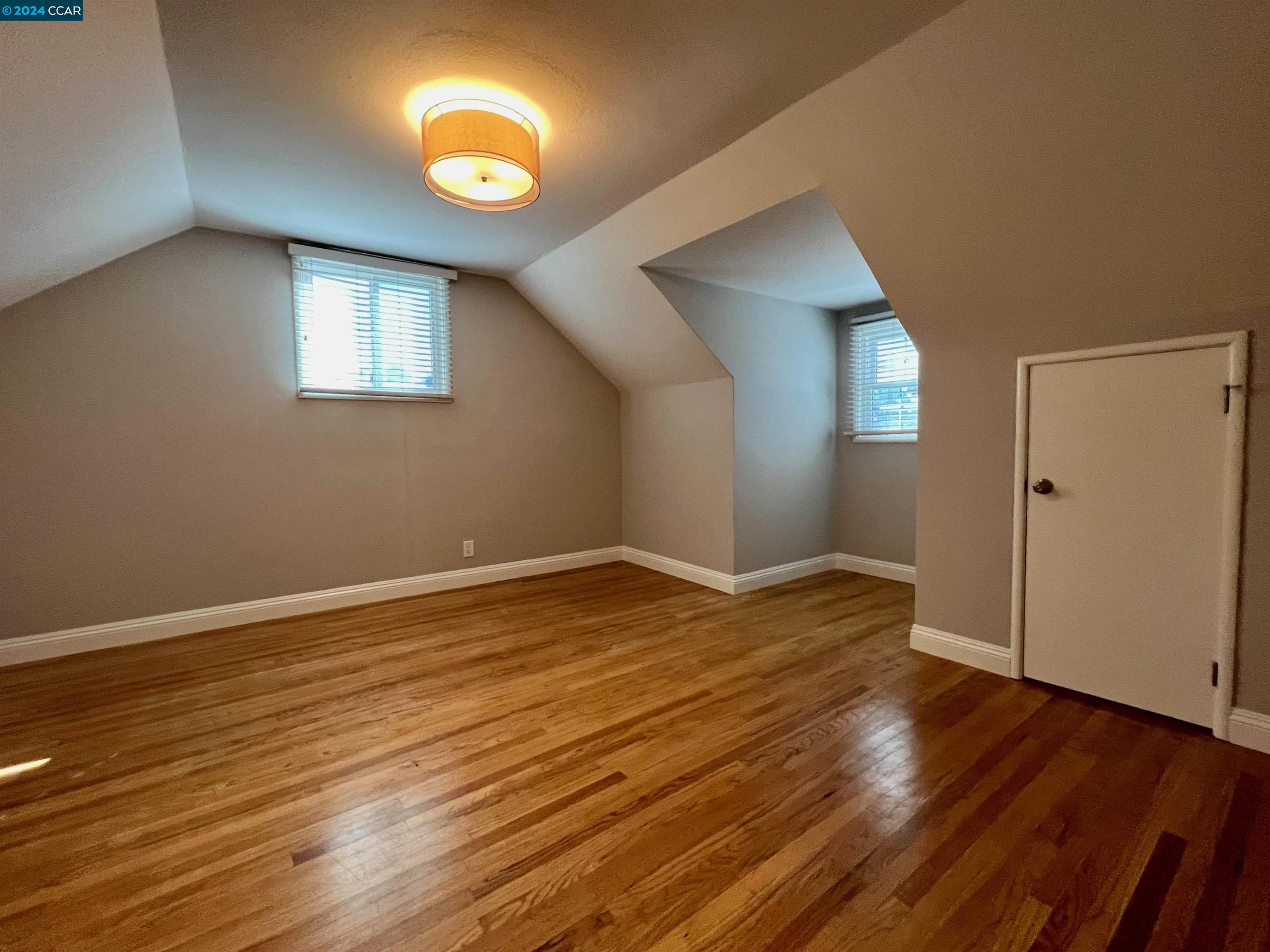 1282 Windermere Way Concord, CA 94521 - Photo 10 of 21 a view of empty room with wooden floor and window