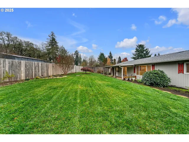 a backyard of a house with lots of green space