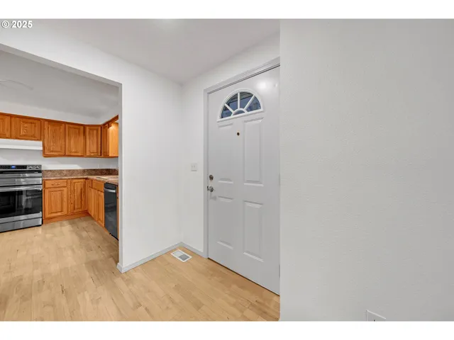 a view of kitchen with wooden floor