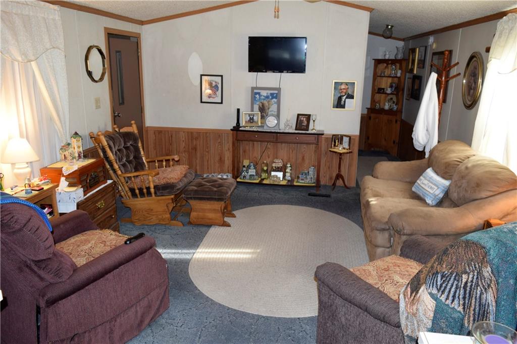 254 Piper Gross Road Latrobe, PA 15650 - Photo 14 of 42 a living room with furniture and a flat screen tv