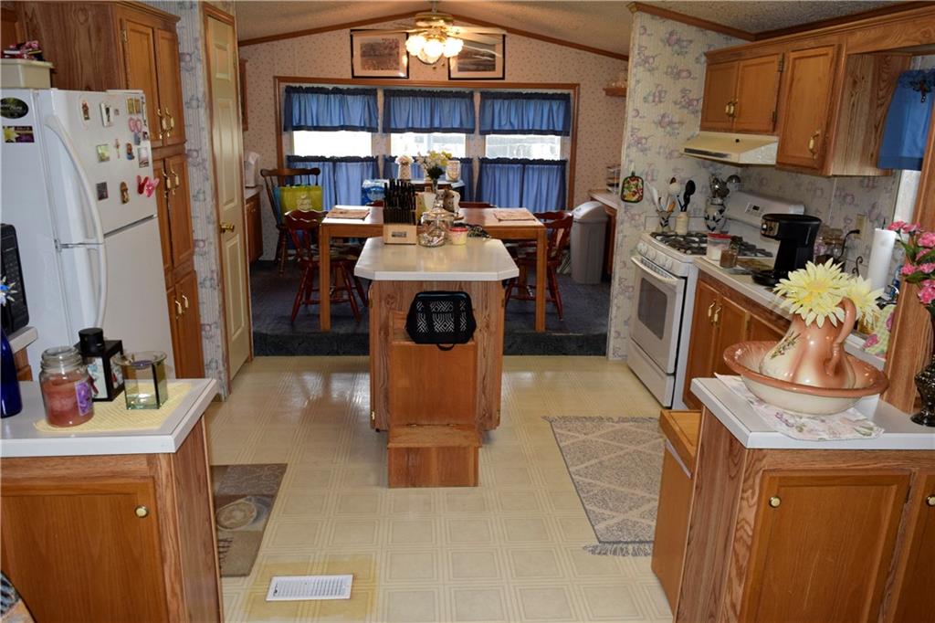 254 Piper Gross Road Latrobe, PA 15650 - Photo 15 of 42 a view of a kitchen with fridge and workspace