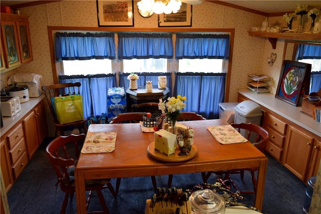 254 Piper Gross Road Latrobe, PA 15650 - Photo 17 of 42 a view of a dining room with furniture window and wooden floor