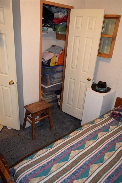 254 Piper Gross Road Latrobe, PA 15650 - Photo 23 of 42 a bedroom with a bed and cabinets