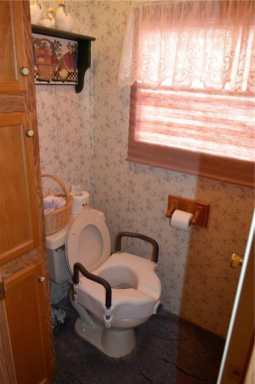 254 Piper Gross Road Latrobe, PA 15650 - Photo 27 of 42 a bathroom with a toilet sink and mirror