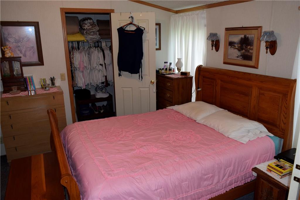 254 Piper Gross Road Latrobe, PA 15650 - Photo 28 of 42 a bedroom with a bed and a flat screen tv