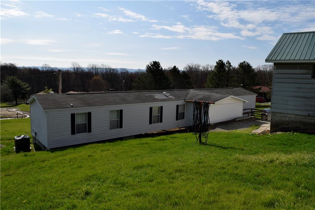 254 Piper Gross Road Latrobe, PA 15650 - Photo 3 of 42 a view of a house with backyard and garden