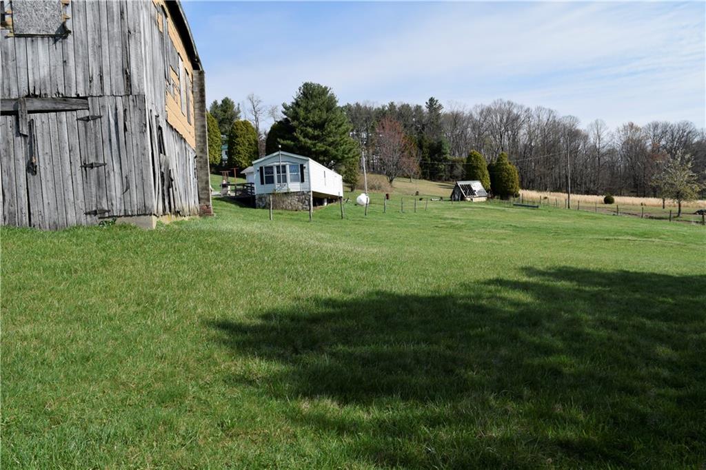 254 Piper Gross Road Latrobe, PA 15650 - Photo 7 of 42 a view of a tiny house with a yard