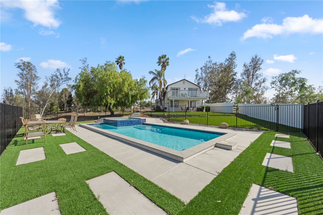 35825 Meadow Ridge Road Temecula, CA 92592 - Photo 26 of 75 a view of a swimming pool with a yard