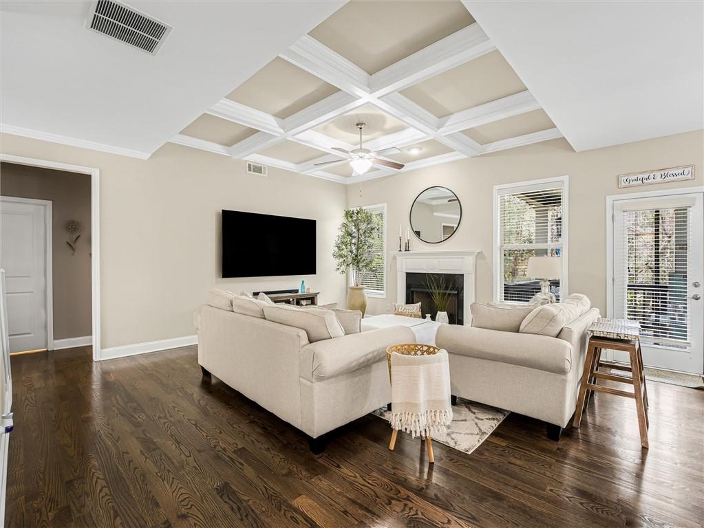 2297 Roberts View Trail Buford, GA 30519 - Photo 12 of 64 a living room with fireplace furniture and a flat screen tv