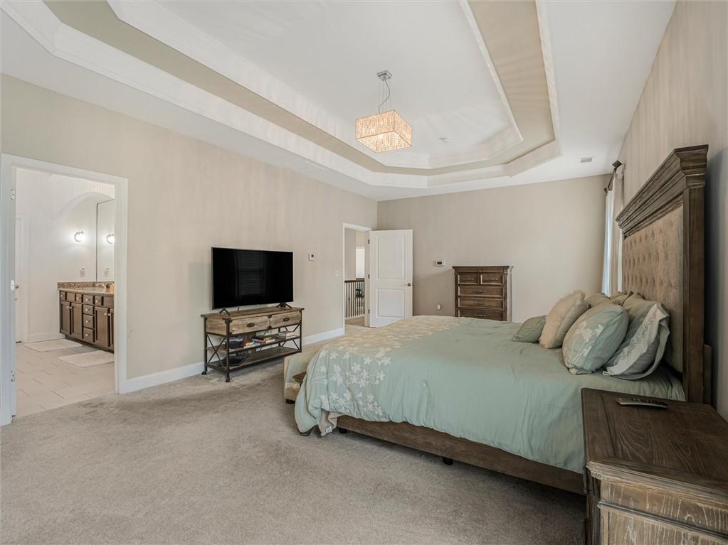 2297 Roberts View Trail Buford, GA 30519 - Photo 32 of 64 a bedroom with a bed and a television