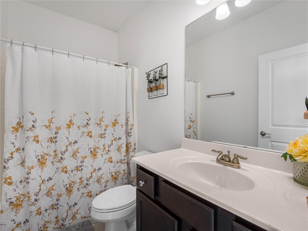 2297 Roberts View Trail Buford, GA 30519 - Photo 48 of 64 a bathroom with a sink toilet and shower
