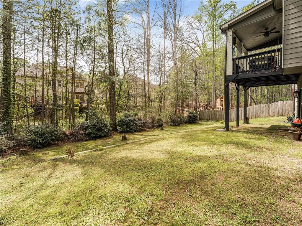 2297 Roberts View Trail Buford, GA 30519 - Photo 53 of 64 a view of a house with backyard and trees