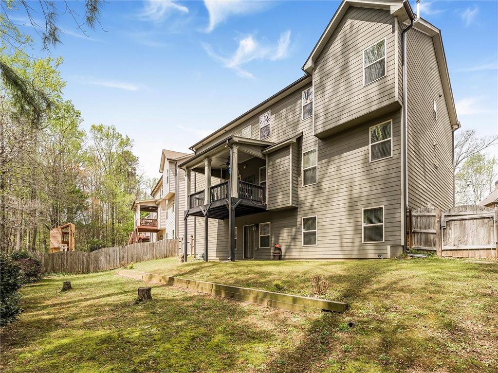 2297 Roberts View Trail Buford, GA 30519 - Photo 54 of 64 a view of a house with a swimming pool