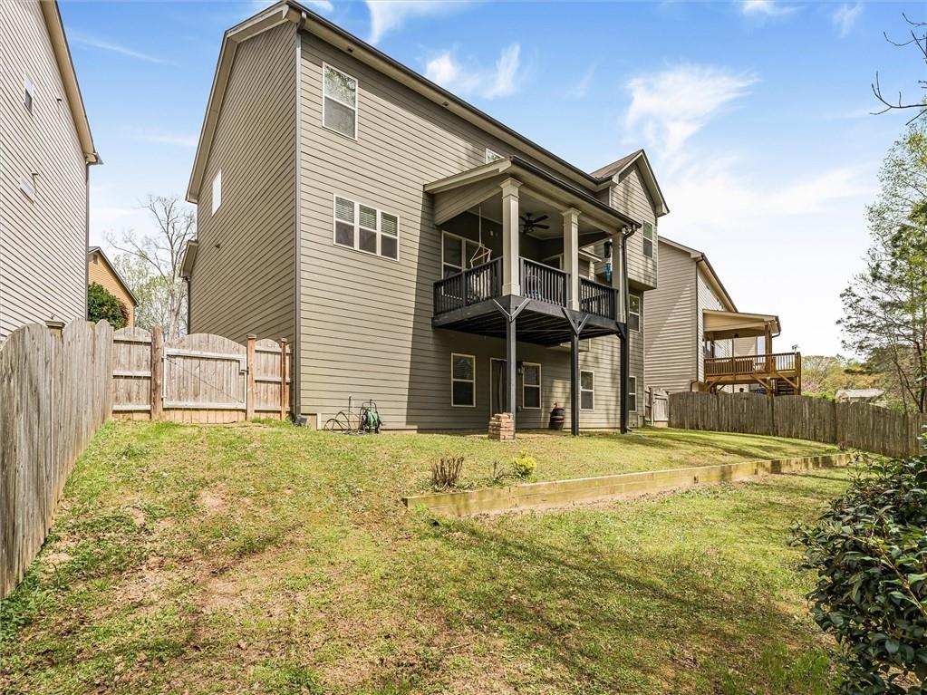 2297 Roberts View Trail Buford, GA 30519 - Photo 55 of 64 a front view of a house with a yard