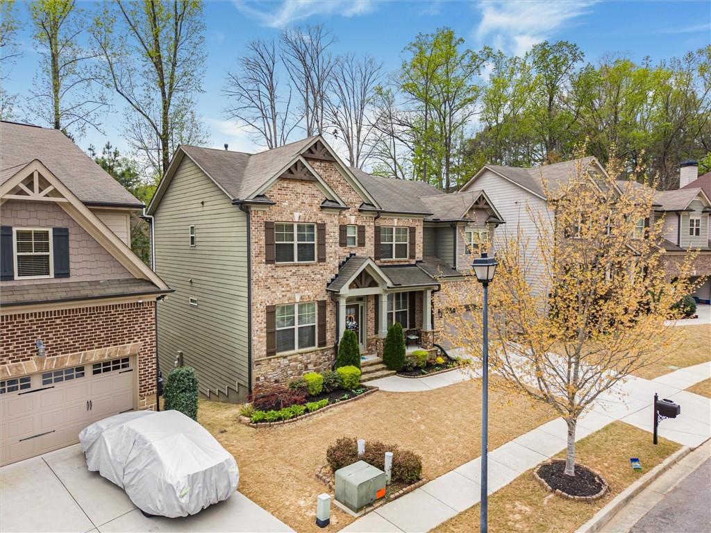 2297 Roberts View Trail Buford, GA 30519 - Photo 56 of 64 a front view of a house with garden
