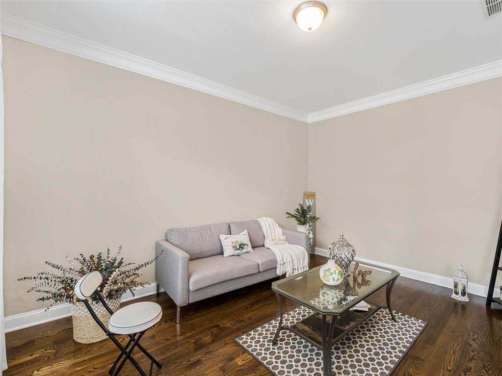 2297 Roberts View Trail Buford, GA 30519 - Photo 6 of 64 a living room with furniture and a rug