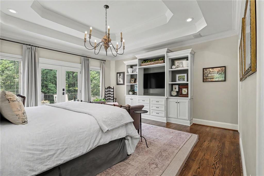 2375 Massey Lane Decatur, GA 30033 - Photo 32 of 88 a spacious bedroom with a bed and a flat screen tv