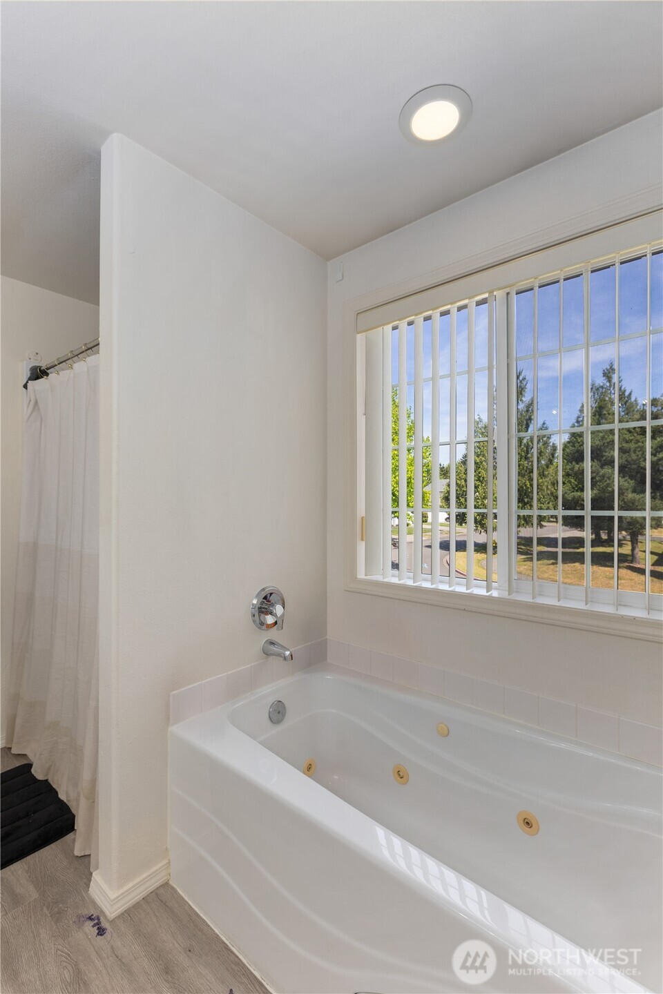 8305 Sweetbrier Loop Southeast Olympia, WA 98513 - Photo 23 of 40 a bathroom with a bathtub and a shower