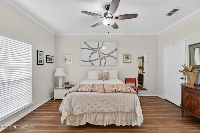 a bedroom with a bed and a table