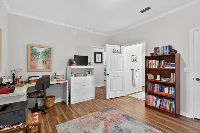 a bathroom with a toilet a sink and a large mirror