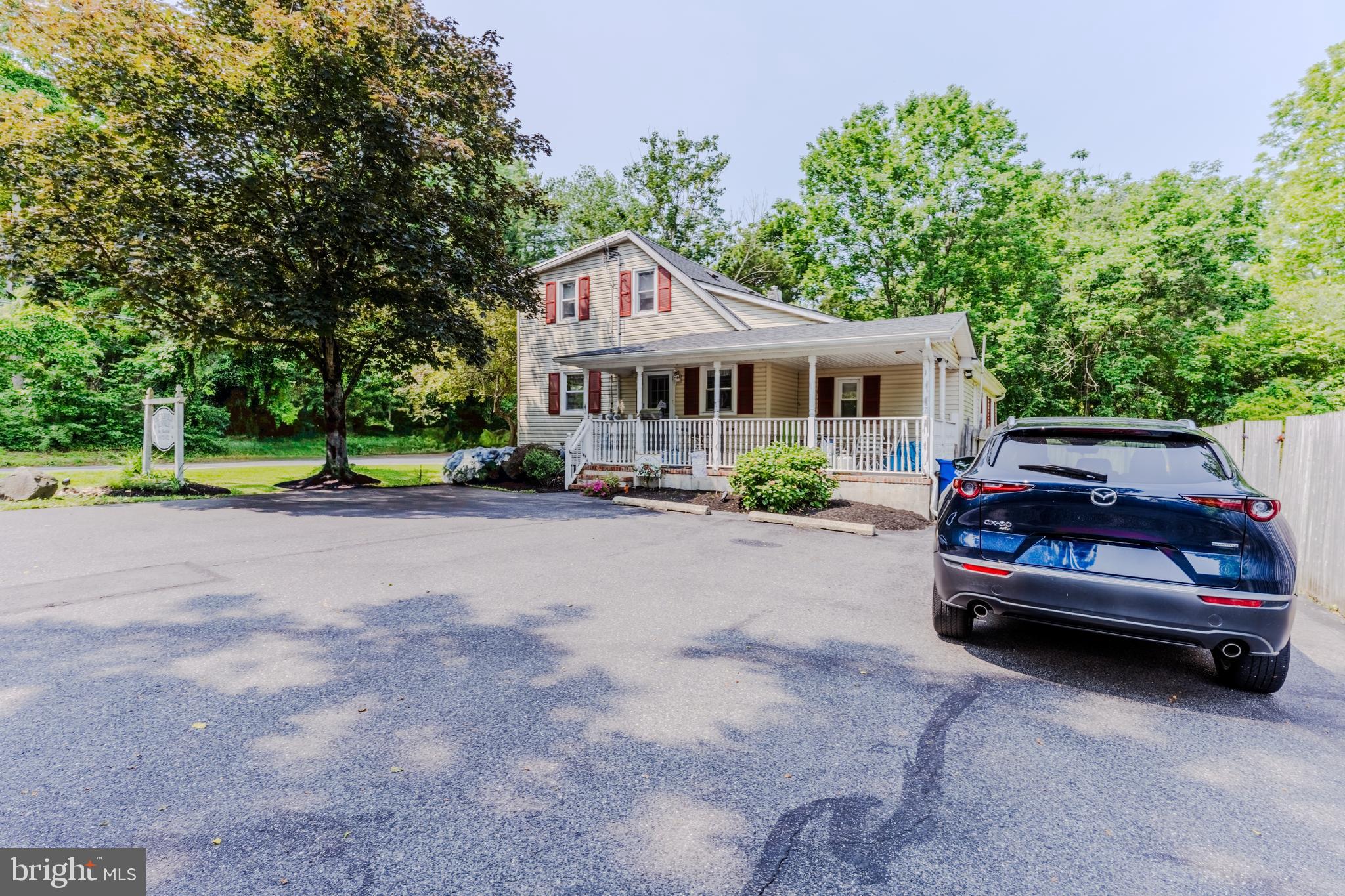 713 Monmouth Road Chesterfield, NJ 08515 - Photo 1 of 25 a car parked in front of a house