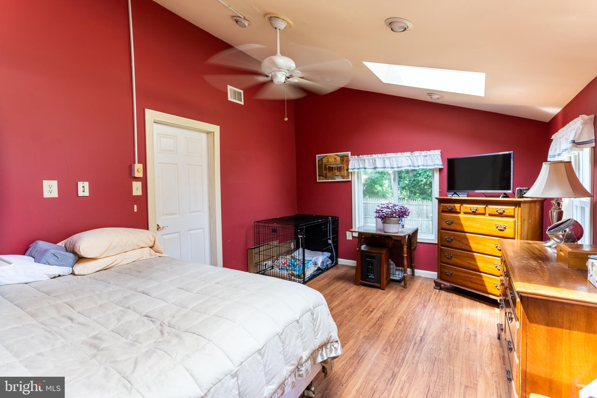 713 Monmouth Road Chesterfield, NJ 08515 - Photo 21 of 25 a bedroom with a bed and wooden floor