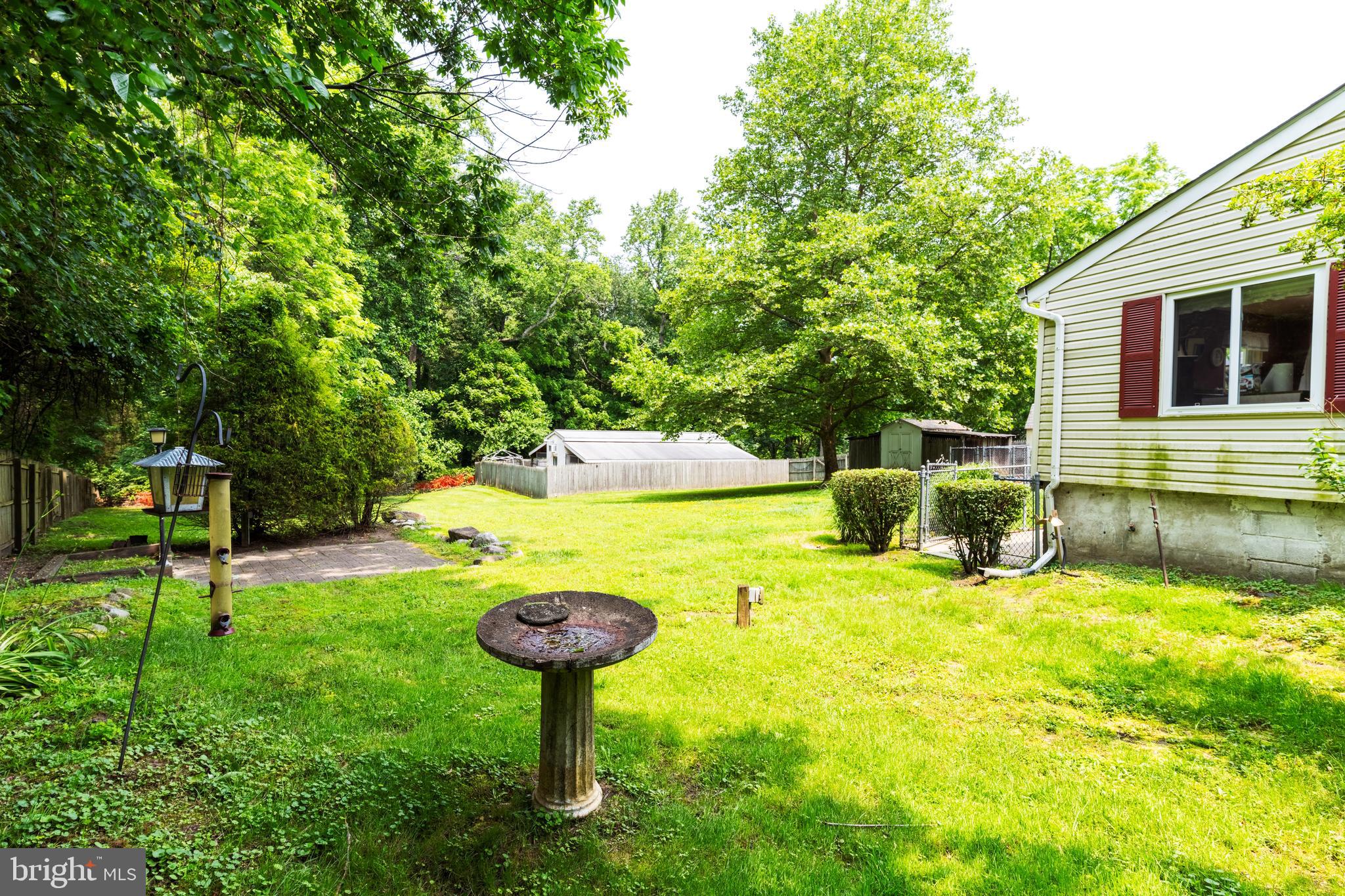 713 Monmouth Road Chesterfield, NJ 08515 - Photo 6 of 25 a view of a backyard with a small house