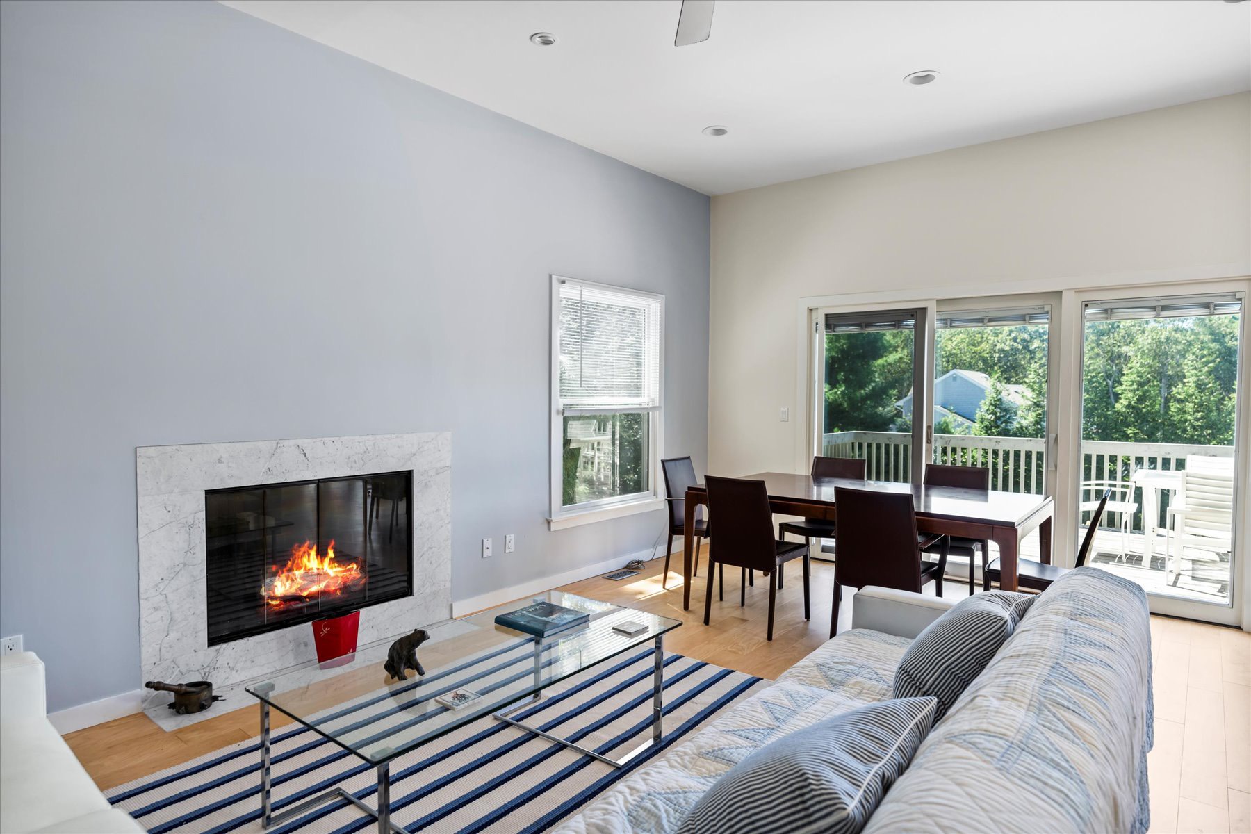 11 Deer Trail Road Southampton, NY 11968 - Photo 12 of 24 a living room with furniture fireplace and a large window