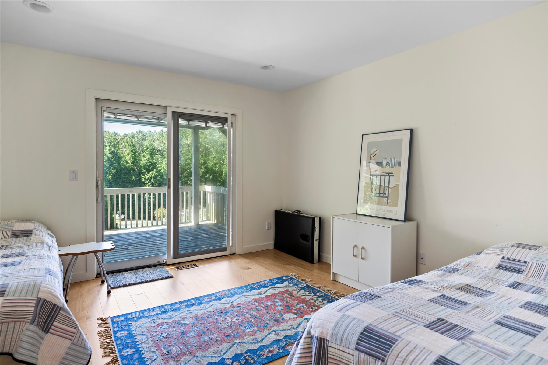 11 Deer Trail Road Southampton, NY 11968 - Photo 16 of 24 a bedroom with a bed and a window