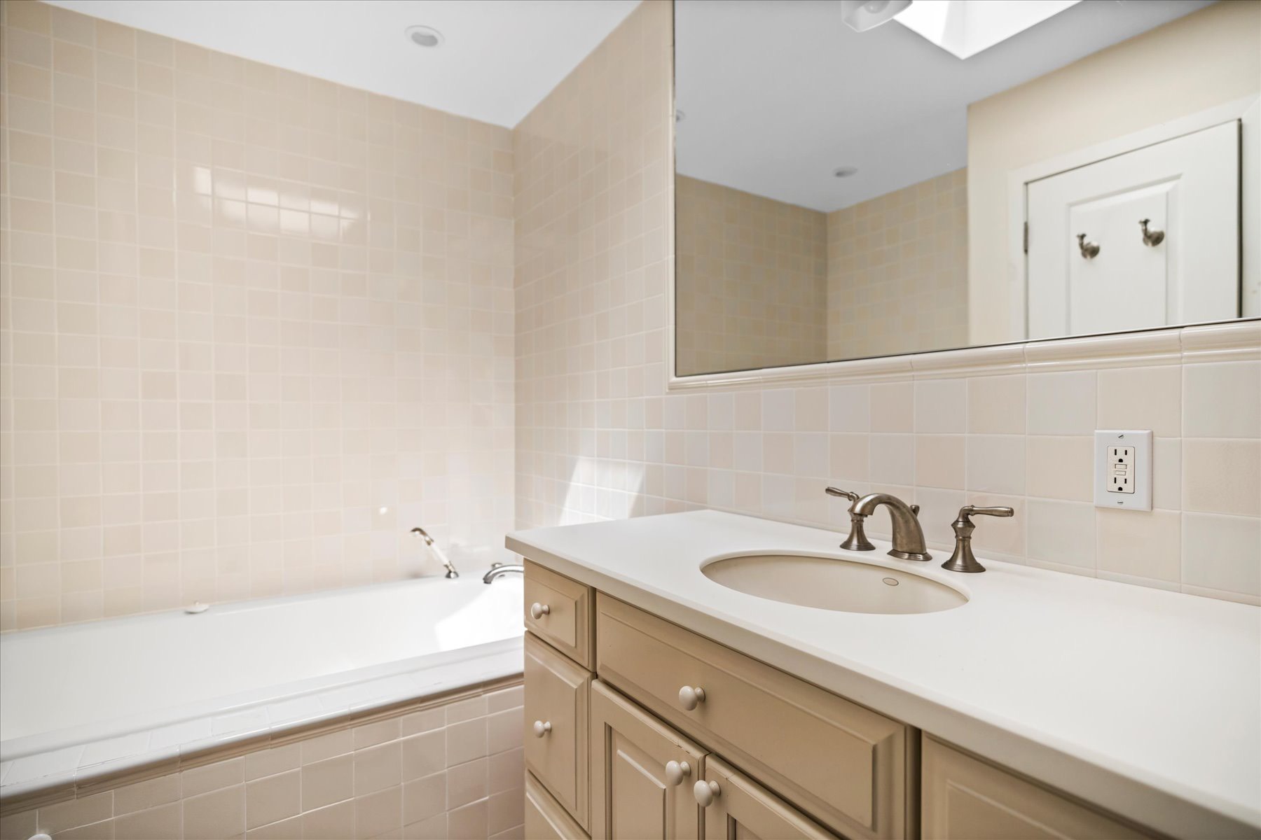 11 Deer Trail Road Southampton, NY 11968 - Photo 19 of 24 a bathroom with a sink and a bathtub