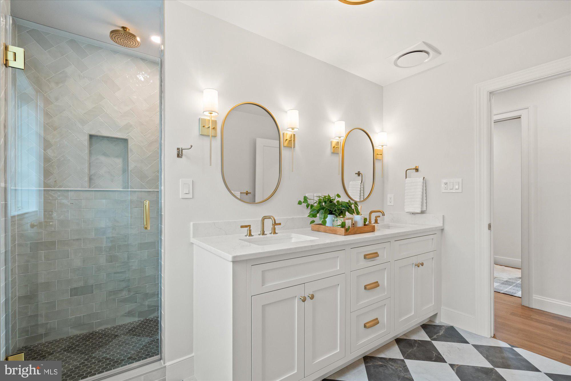 1004 Virginia Avenue Alexandria, VA 22302 - Photo 32 of 63 a bathroom with a double vanity sink mirror and shower