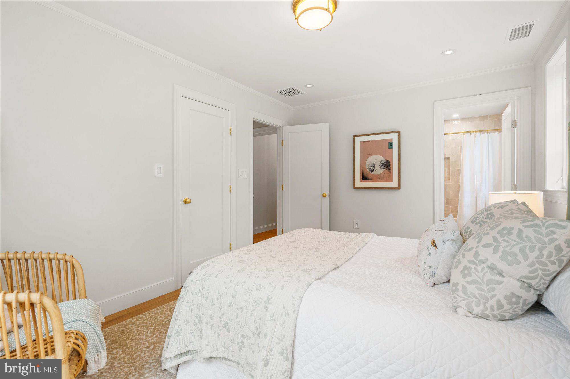 1004 Virginia Avenue Alexandria, VA 22302 - Photo 37 of 63 a bedroom with a bed and wooden floor