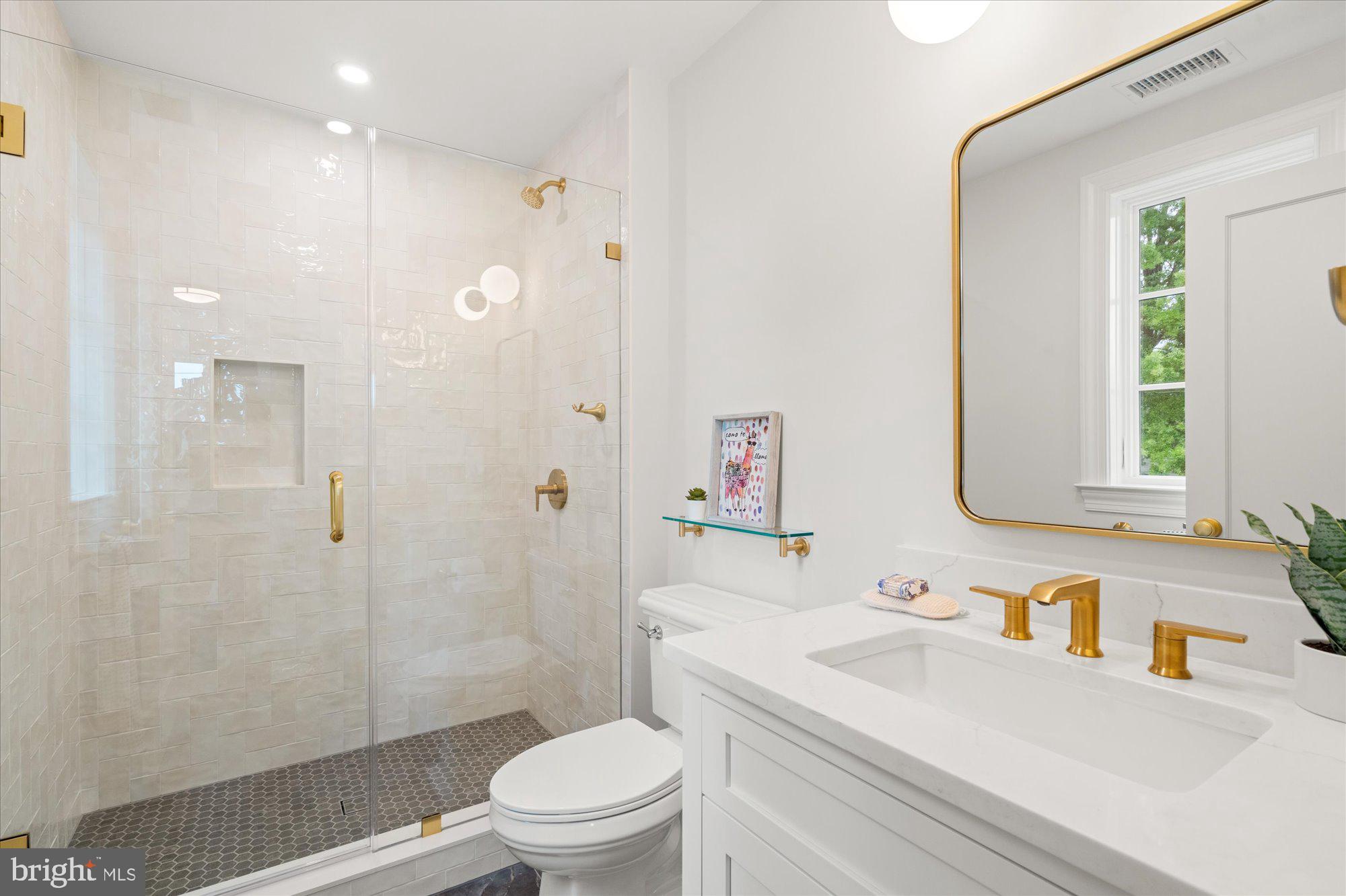 1004 Virginia Avenue Alexandria, VA 22302 - Photo 42 of 63 a bathroom with a sink a toilet and shower