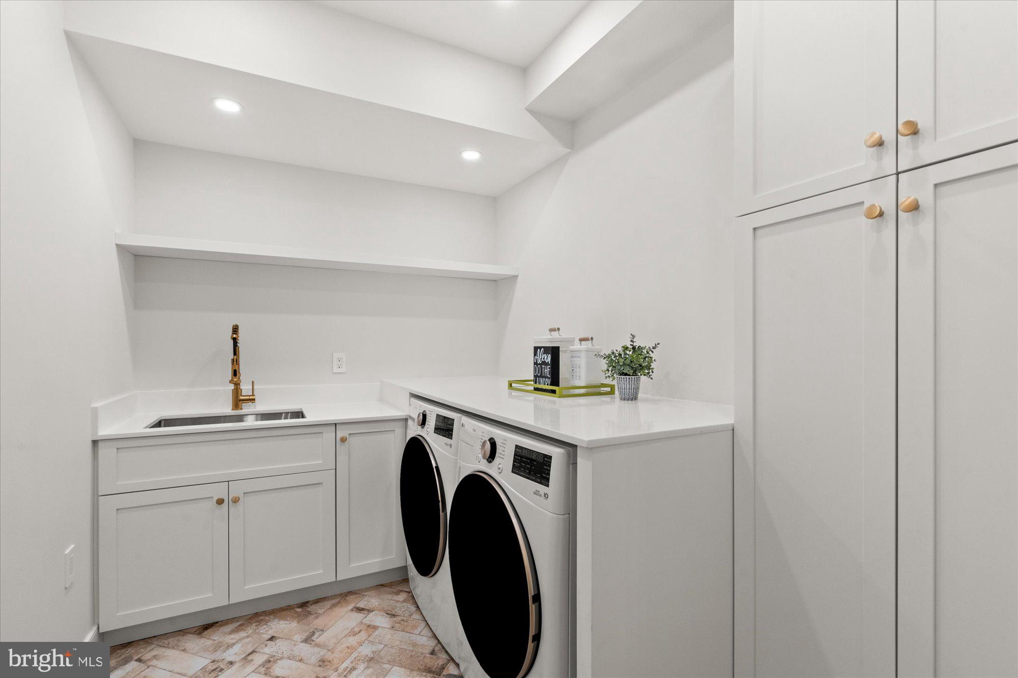 1004 Virginia Avenue Alexandria, VA 22302 - Photo 49 of 63 a view of a storage & utility room with sink washer and dryer