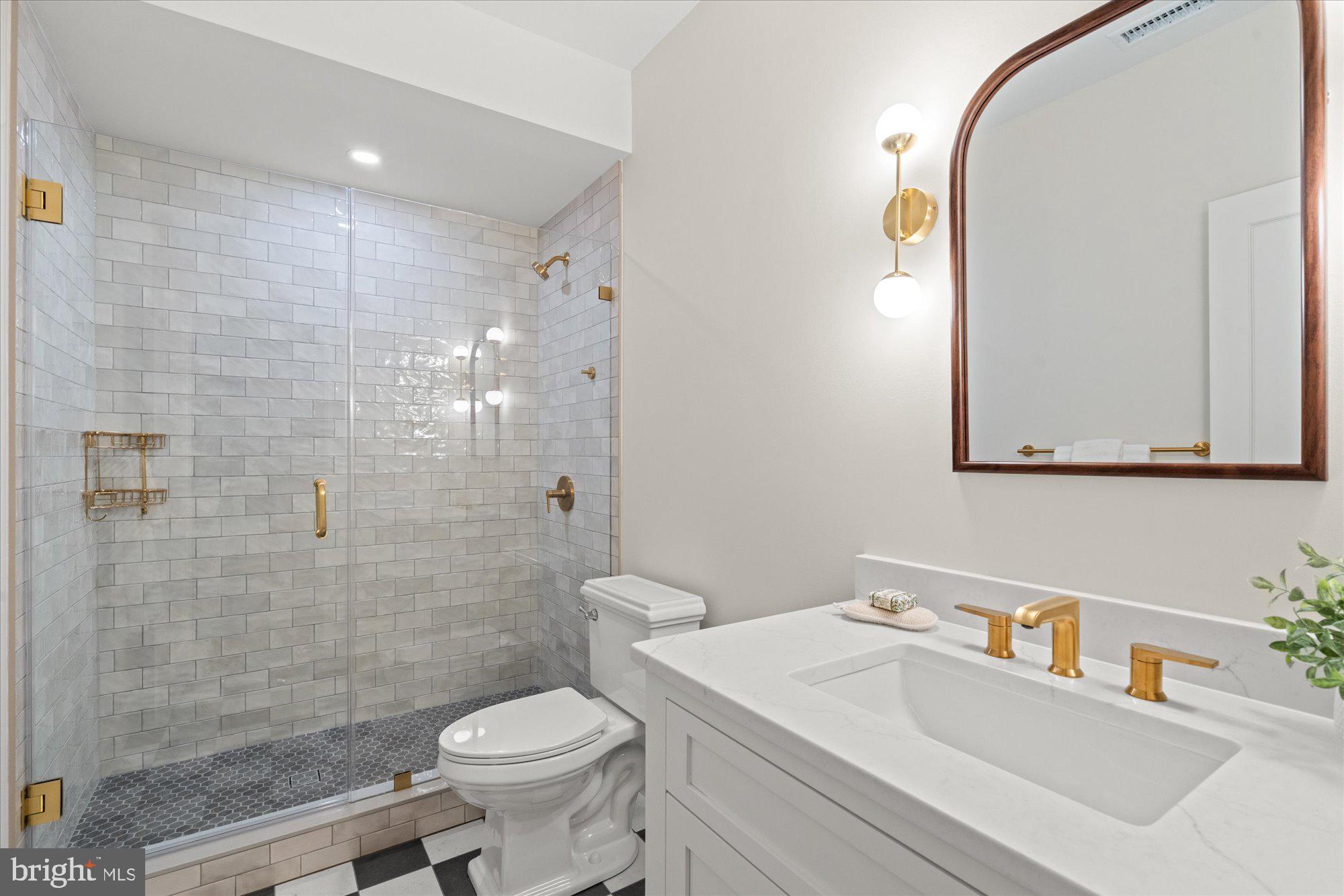 1004 Virginia Avenue Alexandria, VA 22302 - Photo 51 of 63 a bathroom with a sink a toilet and shower