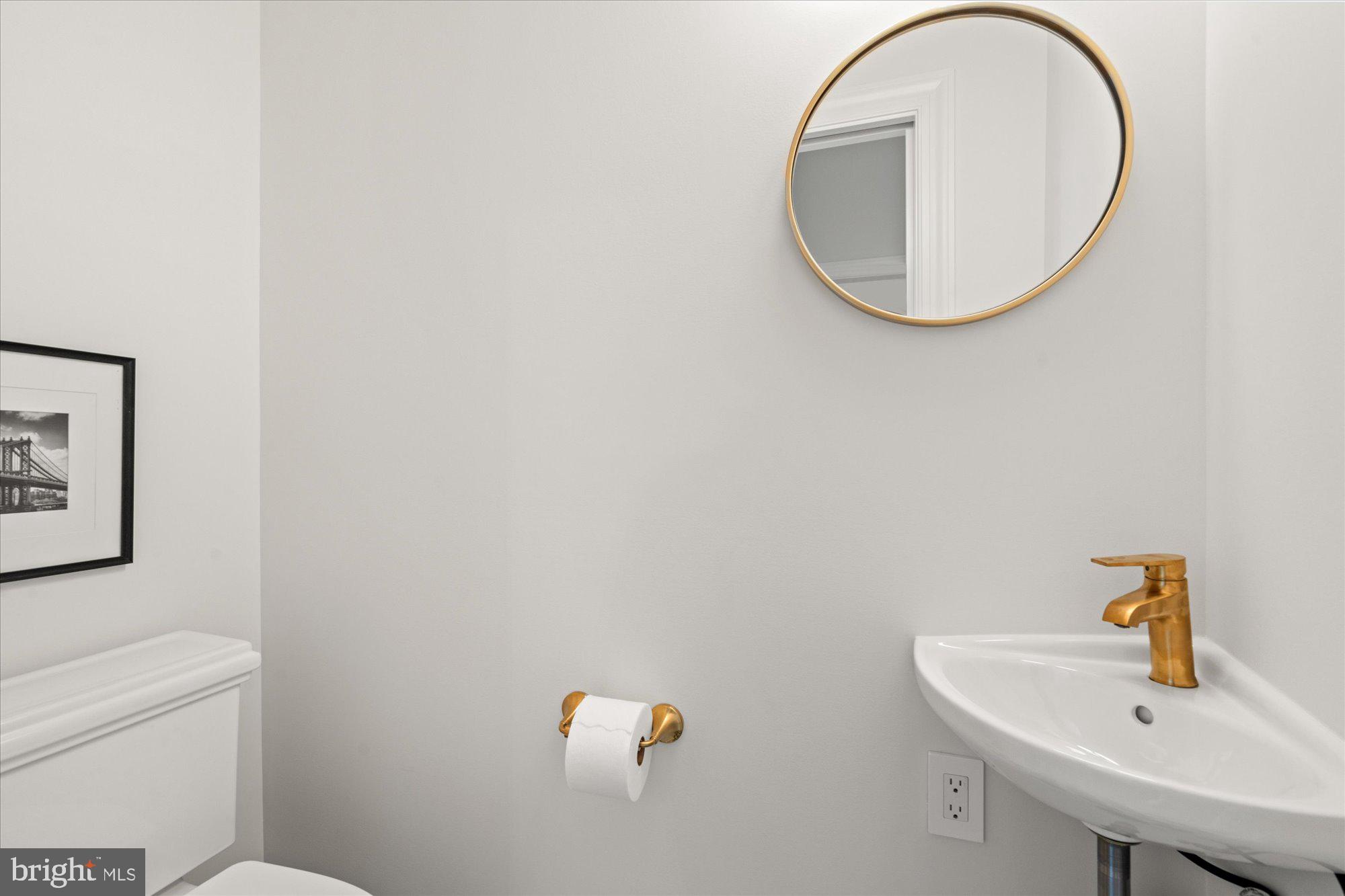 1004 Virginia Avenue Alexandria, VA 22302 - Photo 53 of 63 a bathroom with a sink and a mirror