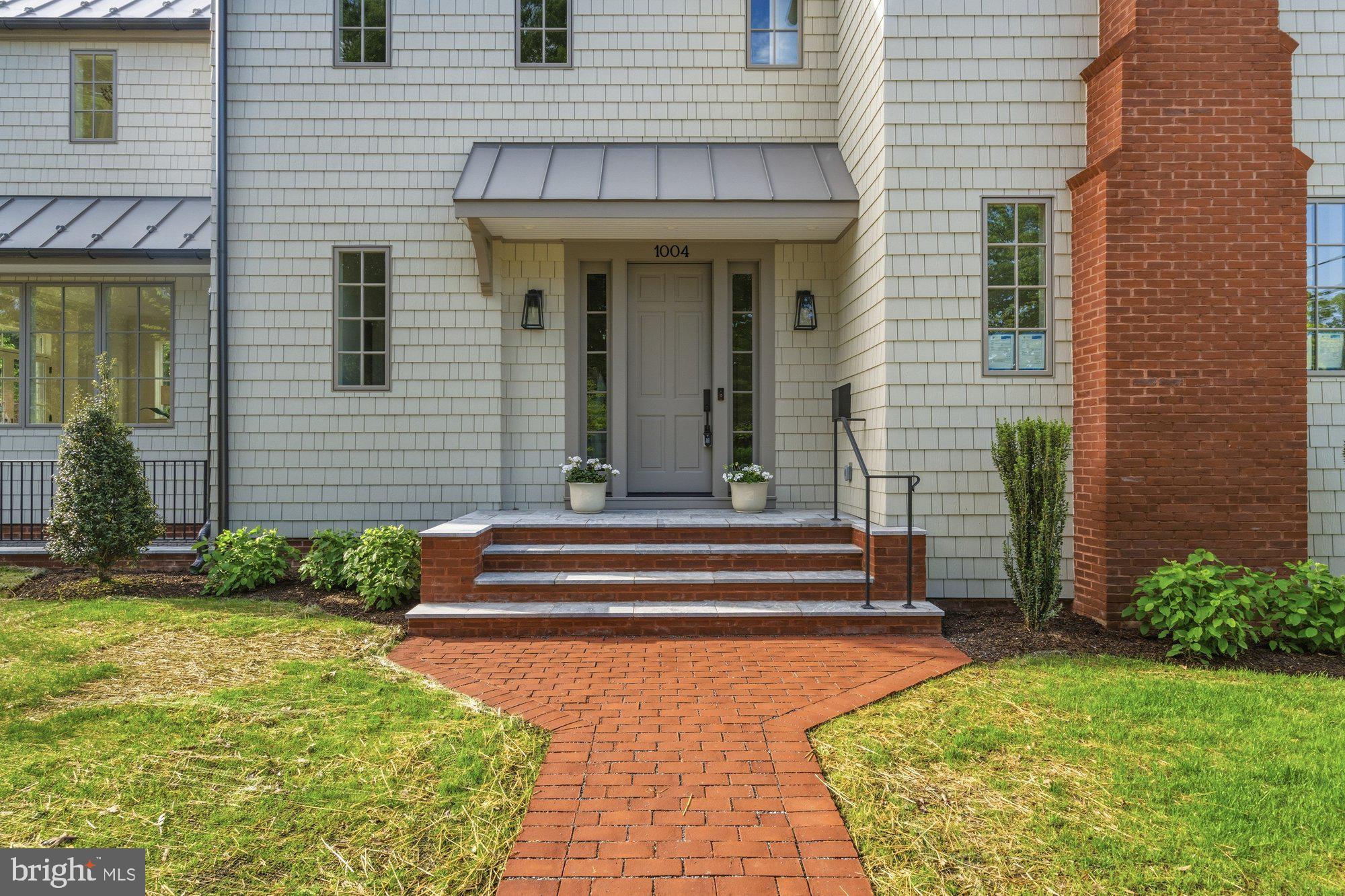 1004 Virginia Avenue Alexandria, VA 22302 - Photo 55 of 63 a front view of a house with a garden