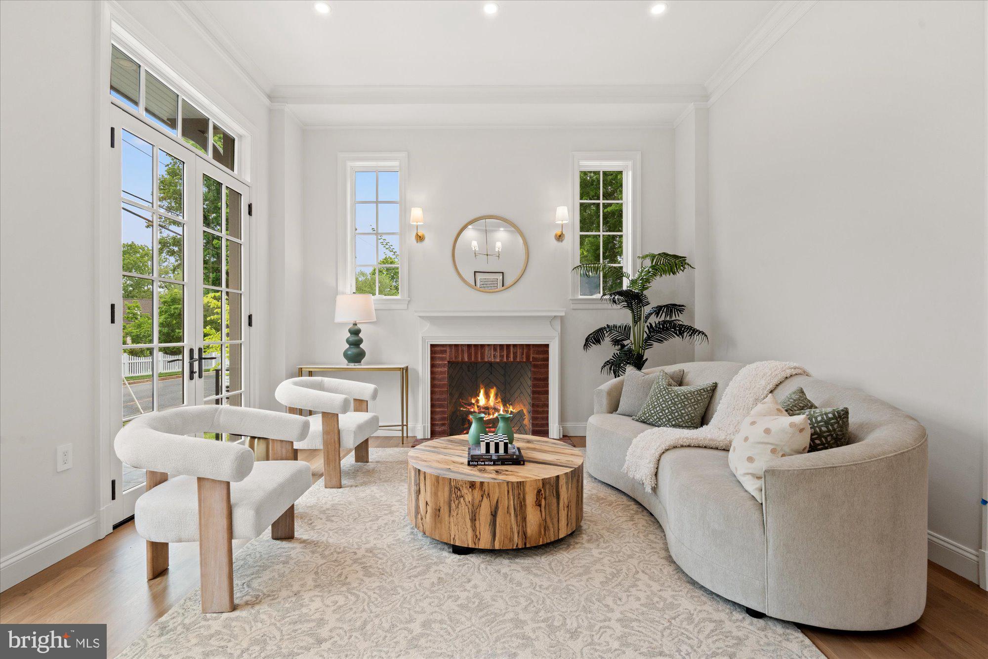 1004 Virginia Avenue Alexandria, VA 22302 - Photo 6 of 63 a living room with furniture a fireplace and a large window