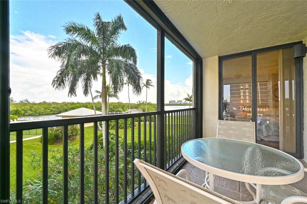 17 Bluebill Avenue, Unit 101 Naples, FL 34108 - Photo 2 of 23 a view of balcony with a potted plant and outdoor space