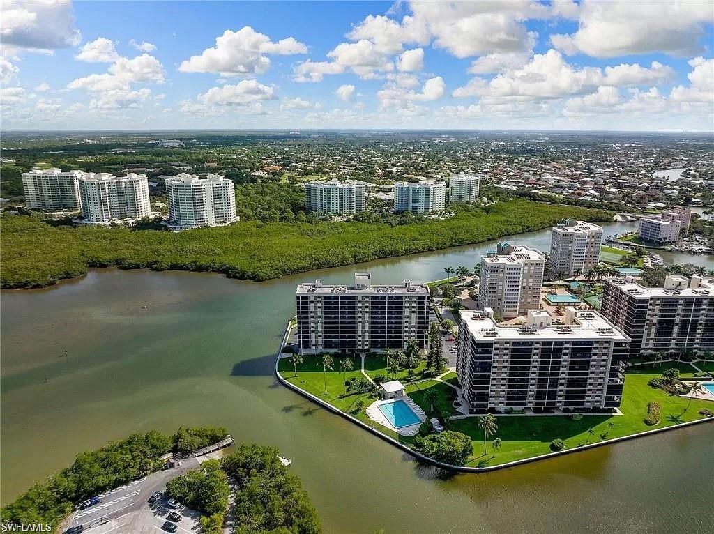 17 Bluebill Avenue, Unit 101 Naples, FL 34108 - Photo 22 of 23 a view of a city with a lake