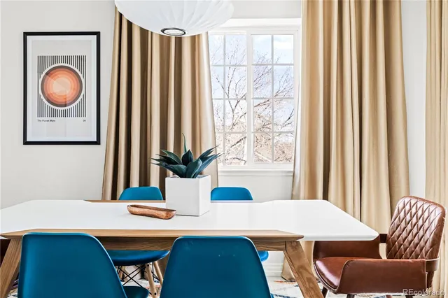 a view of a dining room with furniture and window