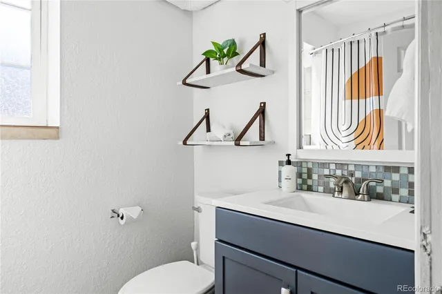 a bathroom with a sink and a toilet
