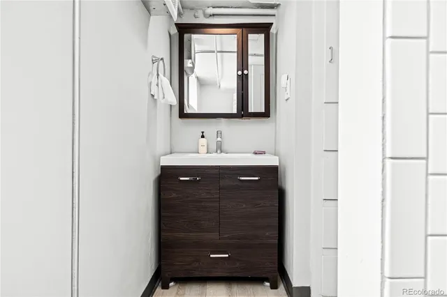 a bathroom with a sink and a mirror