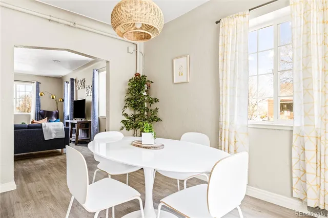 a view of a dining room with furniture window and wooden floor