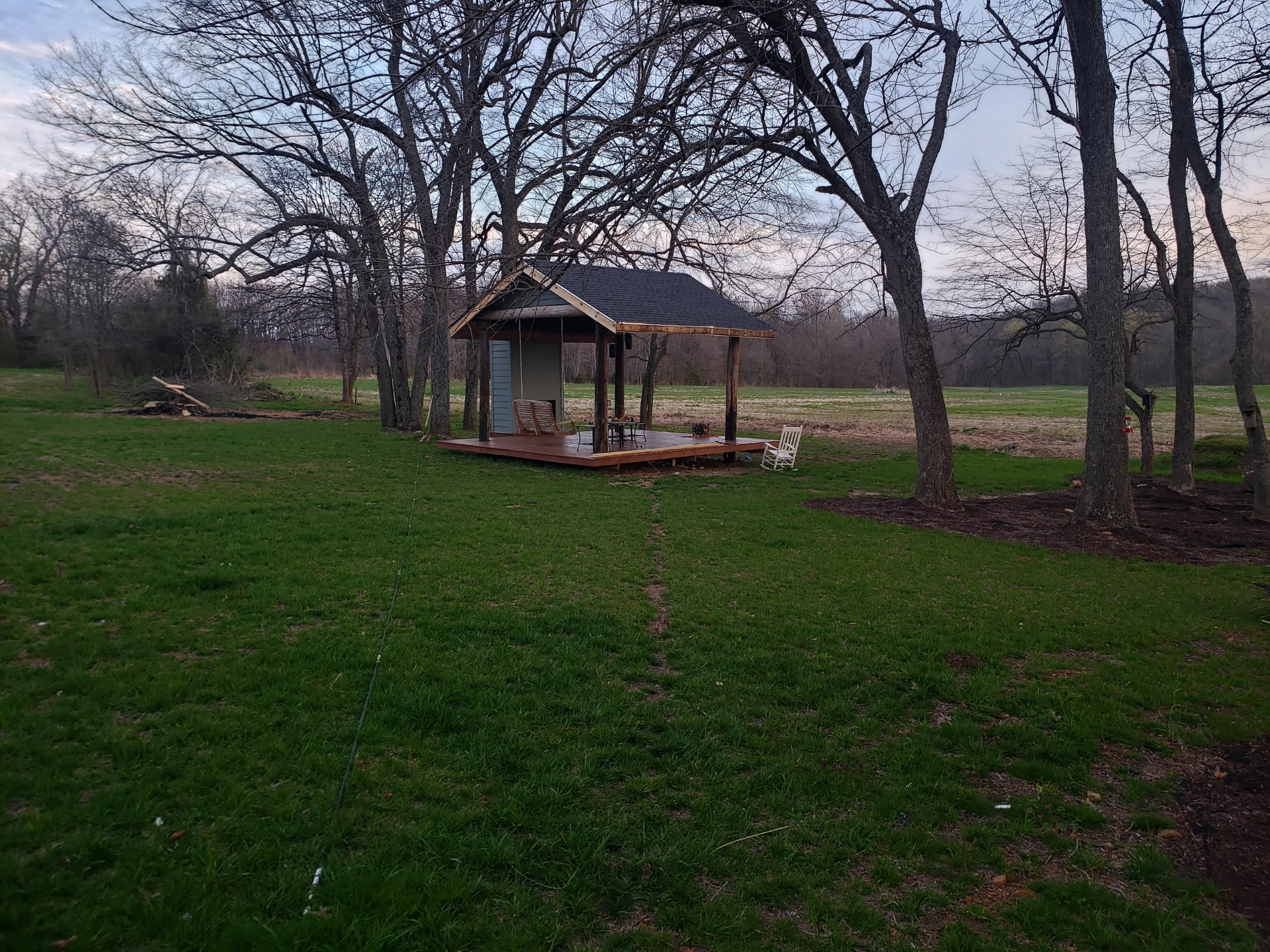 595 Aplin Branch Road Cottontown, TN 37048 - Photo 5 of 8 a backyard of a house with large trees and outdoor seating