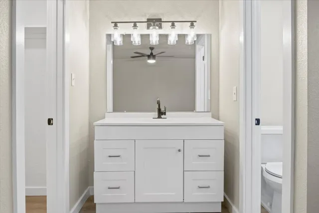 a bathroom with a double vanity sink and mirror