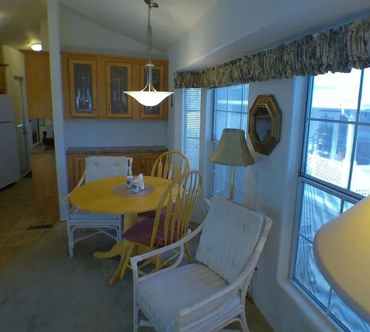 a dinning table and chairs in a room