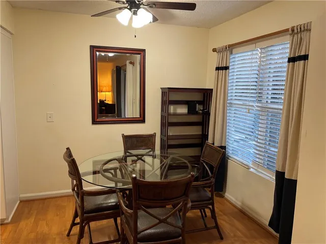a dining room with furniture and window