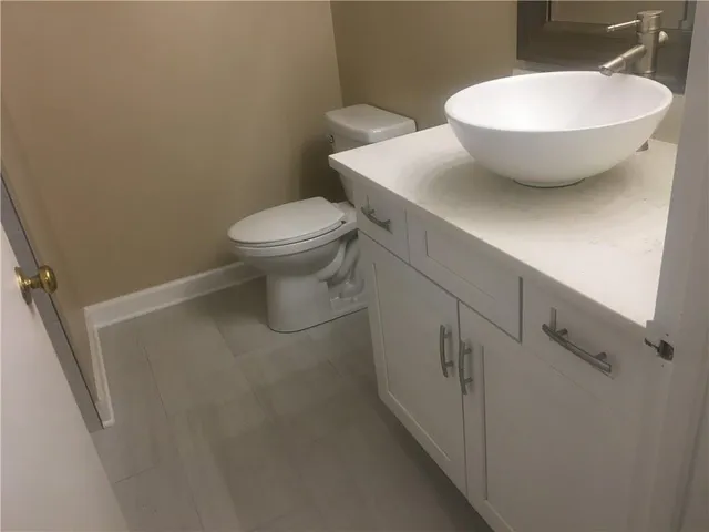 a bathroom with a toilet and a sink